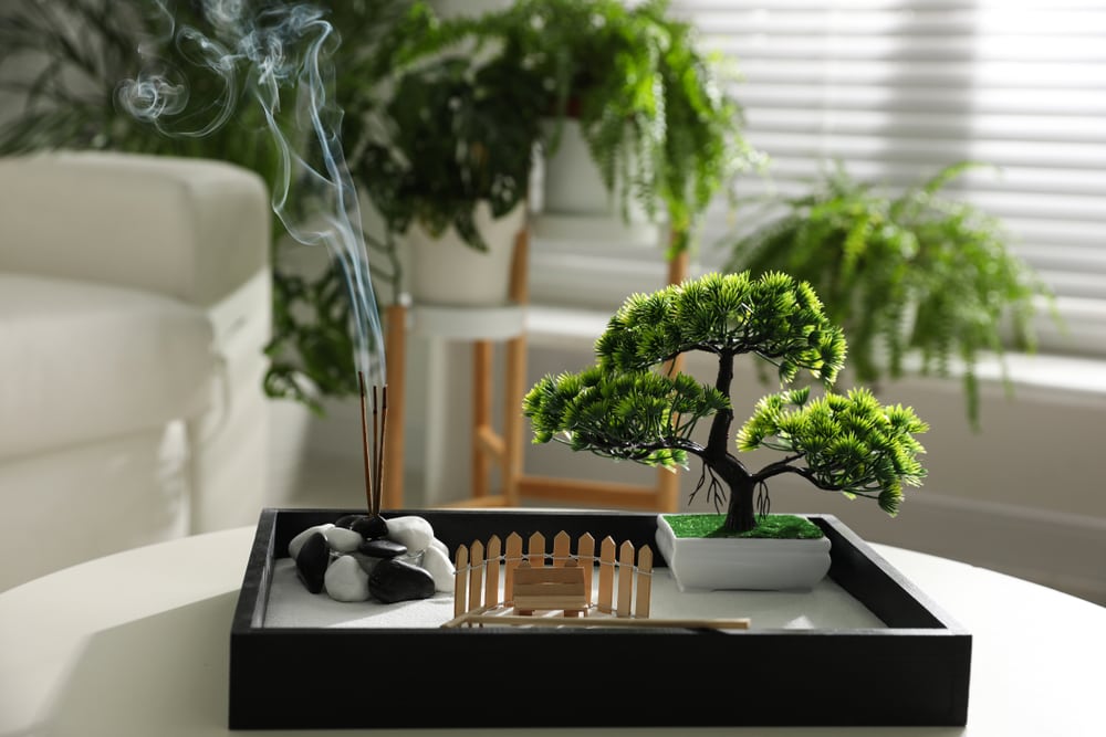 Beautiful,Miniature,Zen,Garden,With,Incense,Sticks,On,Table,Indoors